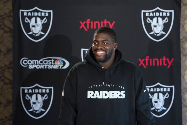 Oakland Raiders offensive tackle Menelik Watson speaks during a press conference at Pennyhill Park, Bagshot, England, Wednesday, Sept. 24, 2014. The Raiders will play the Miami Dolphins in an NFL football game at London's Wembley Stadium on Sunday Sept. 28. (AP Photo/Tim Ireland)