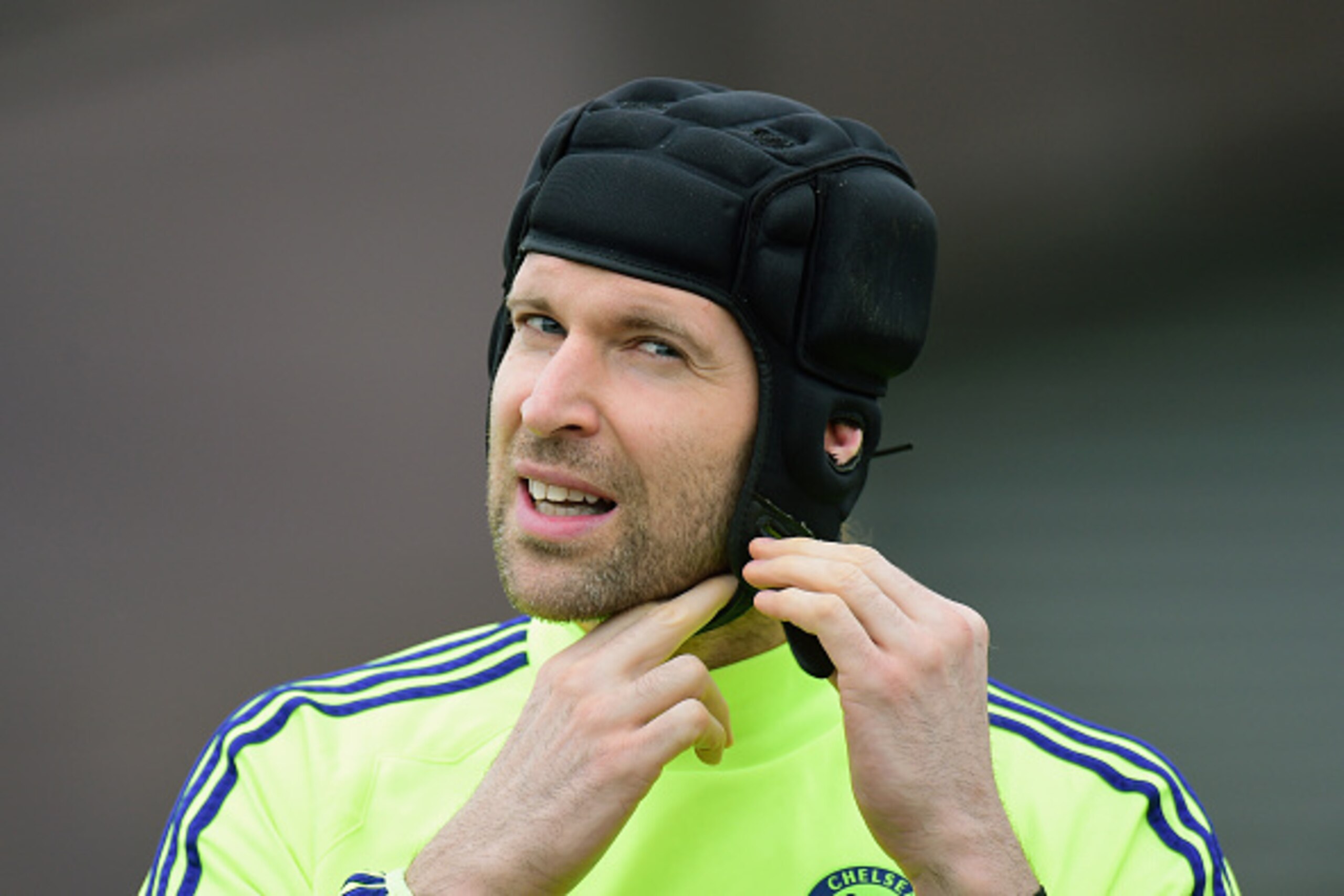 LONDON, ENGLAND - FEBRUARY 16:  Goalkeeper Petr Cech of Chelsea adjusts his protective head gear during a Chelsea training session ahead of the UEFA Champions League round of 16 match against Paris Saint-Germain at Cobham Training Centre on February 16, 2015 in London, United Kingdom.  (Photo by Jamie McDonald/Getty Images)