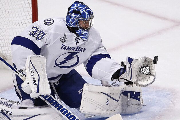 Tampa Bay Lightning goalie Ben Bishop stops a shot during the first period in Game 3 of the NHL hockey Stanley Cup Final against the Chicago Blackhawks on Monday, June 8, 2015, in Chicago. (AP Photo/Charles Rex Arbogast)