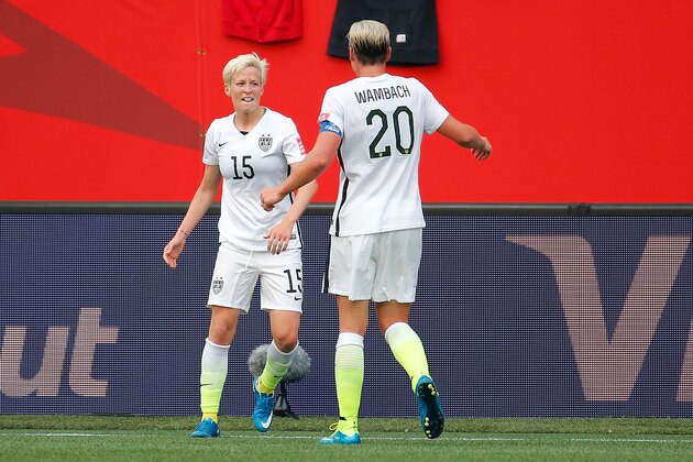 WINNIPEG, MB - JUNE 08:  Megan Rapinoe #15 celebrates with Abby Wambach #20 of United States after Rapinoe scores her second goal against Australia in the second half during the FIFA Women's World Cup 2015 Group D match at Winnipeg Stadium on June 8, 2015 in Winnipeg, Canada.  (Photo by Kevin C. Cox/Getty Images)