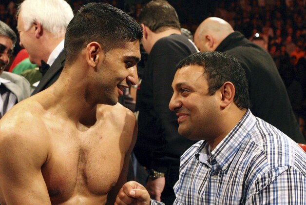 Britain's Amir Khan, left, celebrates his victory with Naseem Hamed, right, following his WBA light-welterweight title fight against Dmitriy Salita, of the U.S. in Newcastle, England on Saturday, Dec. 5, 2009. (AP Photo/Scott Heppell) Britain's Amir Khan, left, celebrates his victory with Naseem Hamed, right, following his WBA light-welterweight title fight against Dmitriy Salita, of the U.S. in Newcastle, England on Saturday, Dec. 5, 2009. (AP Photo/Scott Heppell)
