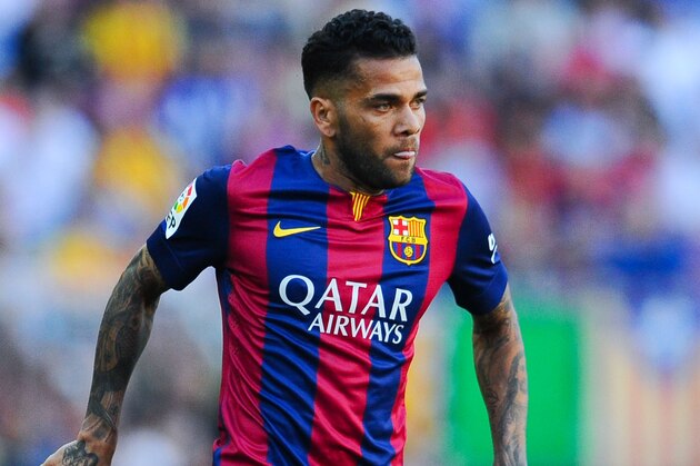 BARCELONA, SPAIN - MAY 09:  Dani Alves of FC Barcelona runs with the ball during the La Liga match between FC Barcelona and Real Sociedad de Futbol at Camp Nou on May 9, 2015 in Barcelona, Spain.  (Photo by David Ramos/Getty Images)