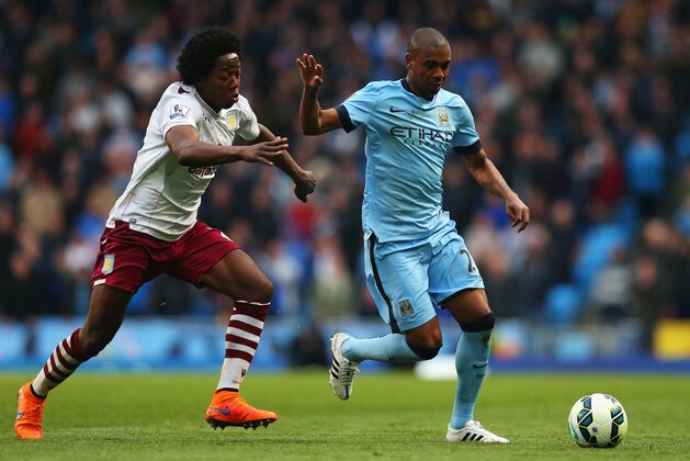 MANCHESTER, ENGLAND - APRIL 25:  Carlos Sanchez of Aston Villa challenges Fernandinho of Manchester City during the Barclays Premier League match between Manchester City and Aston Villa at Etihad Stadium on April 25, 2015 in Manchester, England.  (Photo by Alex Livesey/Getty Images)