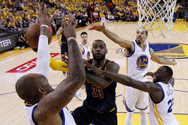 OAKLAND, CA - JUNE 07:  LeBron James #23 of the Cleveland Cavaliers goes up against Marreese Speights #5 of the Golden State Warriors in the second half during Game Two of the 2015 NBA Finals at ORACLE Arena on June 7, 2015 in Oakland, California. NOTE TO USER: User expressly acknowledges and agrees that, by downloading and or using this photograph, user is consenting to the terms and conditions of Getty Images License Agreement.  (Photo by Ezra Shaw/Getty Images)