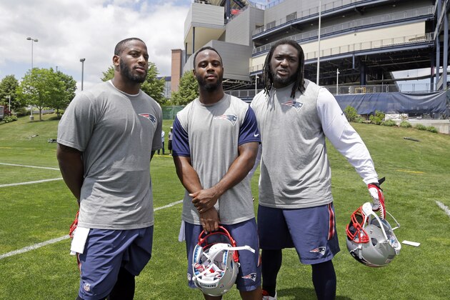 New England Patriots running backs, from left, Jonas Gray, James White and LeGarrette Blount pose together after an NFL football organized team activity in Foxborough, Mass., Friday, May 29, 2015. (AP Photo/Elise Amendola)
