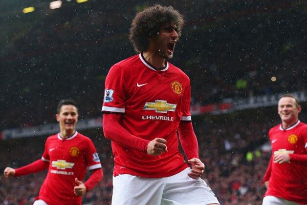 MANCHESTER, ENGLAND - APRIL 12:  Marouane Fellaini of Manchester United (C) celebrates as he scores their second goal with a header during the Barclays Premier League match between Manchester United and Manchester City at Old Trafford on April 12, 2015 in Manchester, England.  (Photo by Alex Livesey/Getty Images)