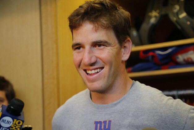 Jun 8, 2015; East Rutherford, NJ, USA; New York Giants quarterback Eli Manning (10) talks to media after  organized team activities at Quest Diagnostics Training Center.  Mandatory Credit: Noah K. Murray-USA TODAY