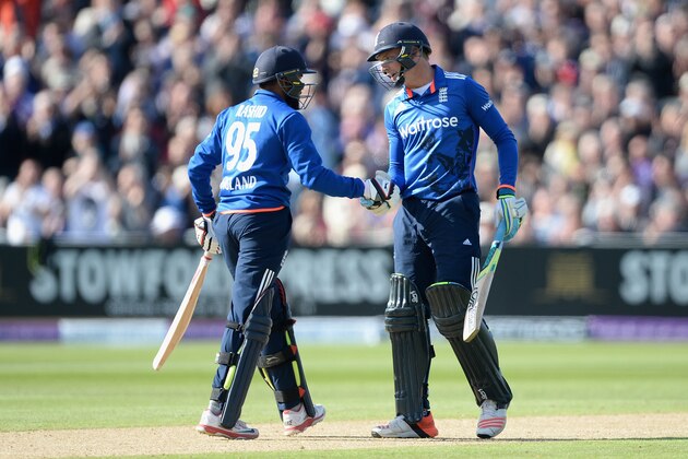 BIRMINGHAM, ENGLAND - JUNE 09:  Jos Buttler of England shakes hands with Adil Rashid during the 1st ODI Royal London One-Day match between England and New Zealand at Edgbaston on June 9, 2015 in Birmingham, England.  (Photo by Gareth Copley/Getty Images)