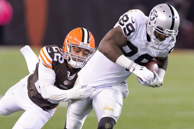 CLEVELAND, OH - OCTOBER 26: Cornerback Buster Skrine #22 of the Cleveland Browns tackles wide receiver James Jones #89 of the Oakland Raiders during the second half at FirstEnergy Stadium in Cleveland, Ohio. The Browns defeated the Raiders 23-13. (Photo by Jason Miller/Getty Images)