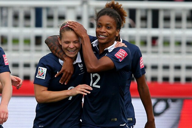 MONCTON, NB - JUNE 09:  Eugenie Le #9 of France is congratulated by teammate Elodie Thomis #12 after Le scored in the first half against England during the FIFA Women's World Cup 2015 Group F match at Moncton Stadium on June 9, 2015 in Moncton, Canada.  (Photo by Elsa/Getty Images)