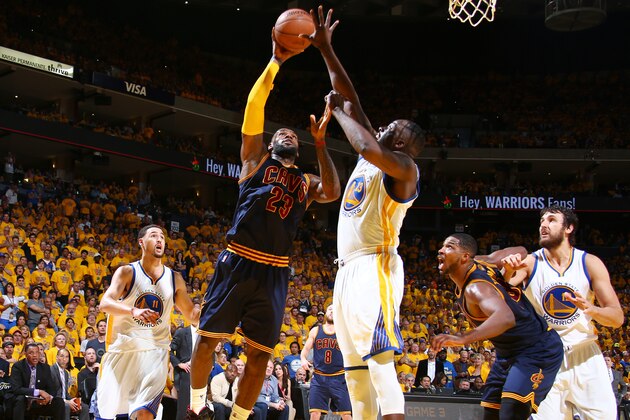 OAKLAND, CA - JUNE 7: LeBron James #23 of the Cleveland Cavaliers shoots against Draymond Green #23 of the Golden State Warriors during Game Two of the 2015 NBA Finals on June 7, 2015 at Oracle Arena in Oakland, California. NOTE TO USER: User expressly acknowledges and agrees that, by downloading and or using this photograph, user is consenting to the terms and conditions of Getty Images License Agreement. Mandatory Copyright Notice: Copyright 2015 NBAE (Photo by Nathaniel S. Butler/NBAE via Getty Images)
