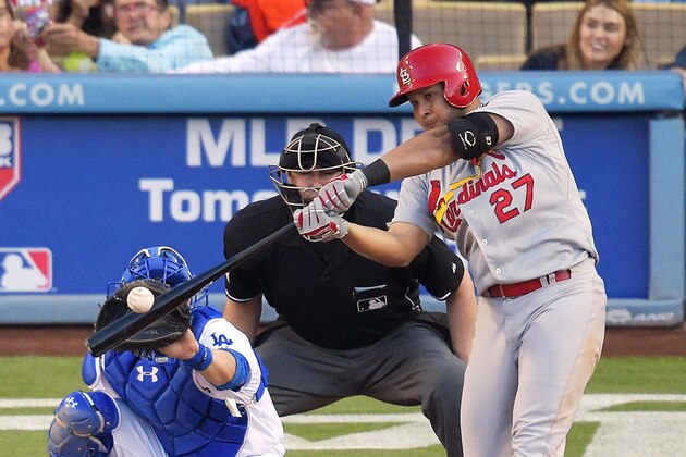 St. Louis Cardinals' Jhonny Peralta, right, hits a solo home run as Los Angeles Dodgers catcher Yasmani Grandal, left, and home plate umpire Lance Barrett watch during the sixth inning of a baseball game, Sunday, June 7, 2015, in Los Angeles. (AP Photo/Mark J. Terrill) St. Louis Cardinals' Jhonny Peralta, right, hits a solo home run as Los Angeles Dodgers catcher Yasmani Grandal, left, and home plate umpire Lance Barrett watch during the sixth inning of a baseball game, Sunday, June 7, 2015, in Los Angeles. (AP Photo/Mark J. Terrill)