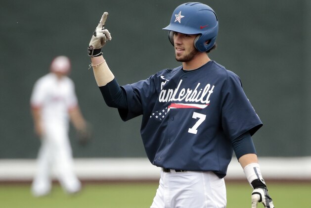 Vanderbilt's Dansby Swanson celebrates on second base after hitting a double against Radford in the first inning of an NCAA regional college baseball game Monday, June 1, 2015, in Nashville, Tenn. (AP Photo/Mark Humphrey)