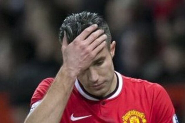 FILE - In this Jan. 11, 2015 file photo, Manchester United's Robin van Persie walks from the pitch after being substituted during his team's English Premier League soccer match between Manchester United and Southampton at Old Trafford Stadium, Manchester, England. (AP Photo/Jon Super, File)