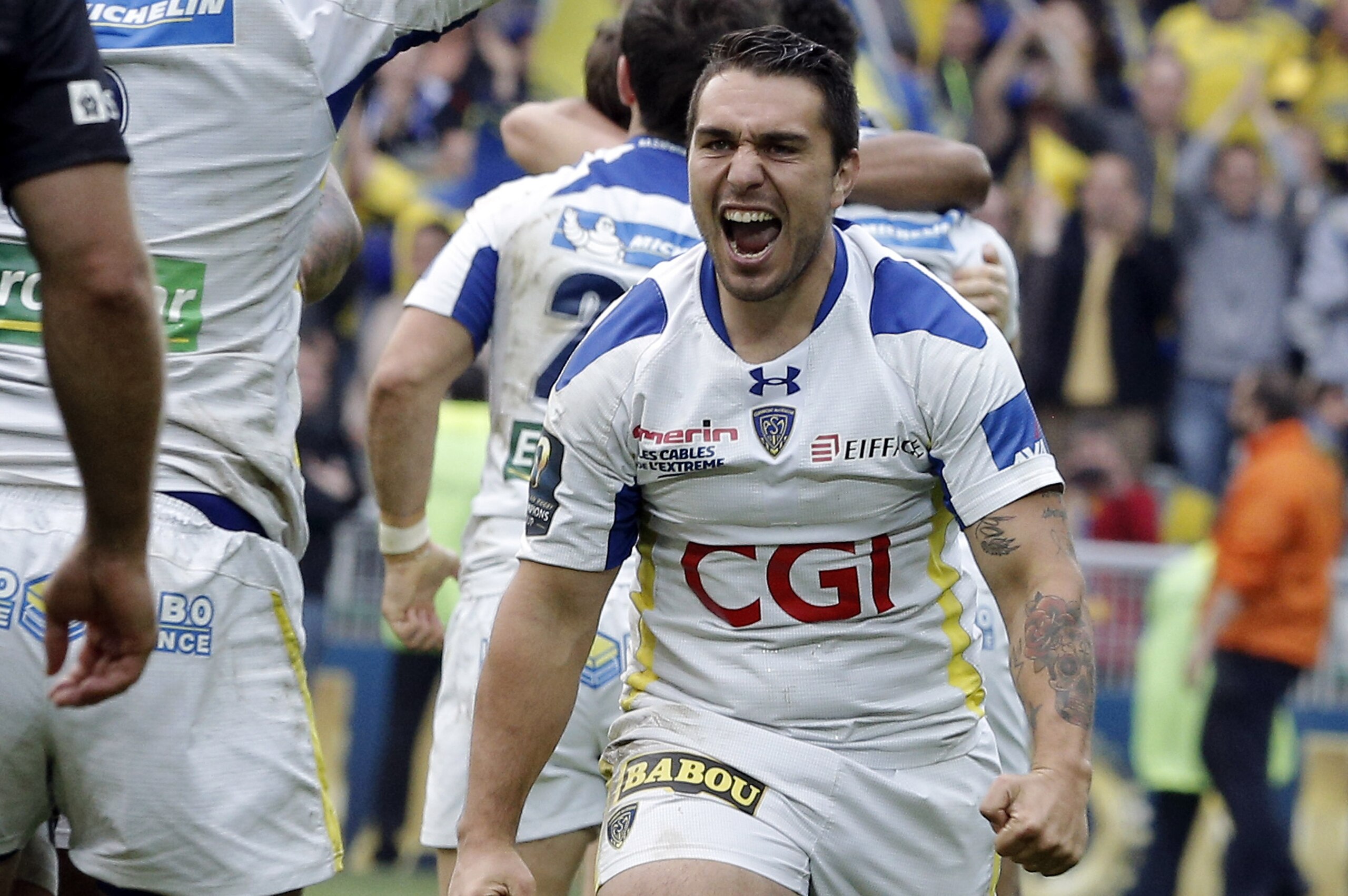 Clermont Ferrand's Ludovic Radoslavjevic celebrates with his teammates after they won their European Champions Cup semifinal match against Saracens, in Saint-Etienne, central France, Saturday, April 18, 2015. (AP Photo/Laurent Cipriani)
