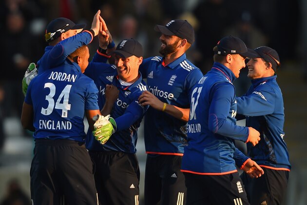 BIRMINGHAM, ENGLAND - JUNE 09:  Jos Buttler of England congratulates Chis Jordan after taking the final wicket during the 1st ODI Royal London One-Day Series 2015 match between England and NewZealand at Edgbaston on June 9, 2015 in Birmingham, England.  (Photo by Shaun Botterill/Getty Images)
