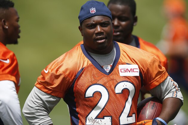 Denver Broncos running back C.J. Anderson waits to take part in drills during a mandatory minicamp at the NFL football team's facility, Tuesday, June 9, 2015, in Englewood, Colo. (AP Photo/David Zalubowski)