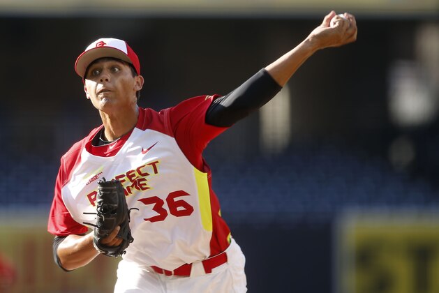 Pitcher Justin Hooper, of De La Salle High School in San Ramon, Calif. during a high school all-star baseball game Sunday, Aug. 10, 2014, in San Diego. (AP Photo/Lenny Ignelzi)