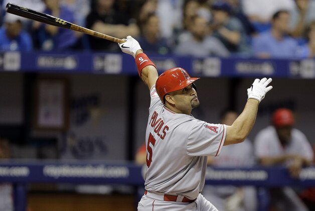 Los Angeles Angels' Albert Pujols watches his home run off Tampa Bay Rays starting pitcher Nathan Karns during the fifth inning of a baseball game Tuesday, June 9, 2015, in St. Petersburg, Fla.  (AP Photo/Chris O'Meara)