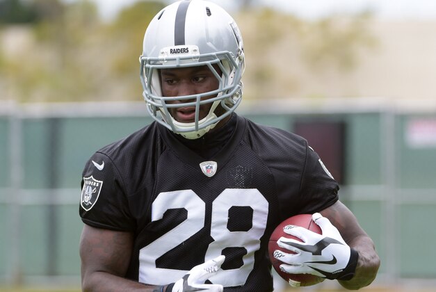May 26, 2015; Alameda, CA, USA; Oakland Raiders running back Latavius Murray (28) carries the ball at organized team activities at the Raiders practice facility. Mandatory Credit: Kirby Lee-USA TODAY Sports