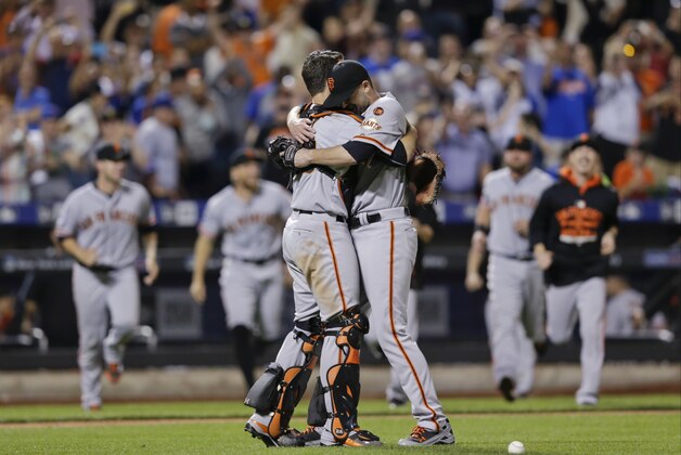 San Francisco Giants starting pitcher Chris Heston hugs catcher Buster Posey, left, after Heston's no-hitter in a baseball game against the New York Mets on Tuesday, June 9, 2015, in New York. The Giants won 5-0. (AP Photo/Frank Franklin II)