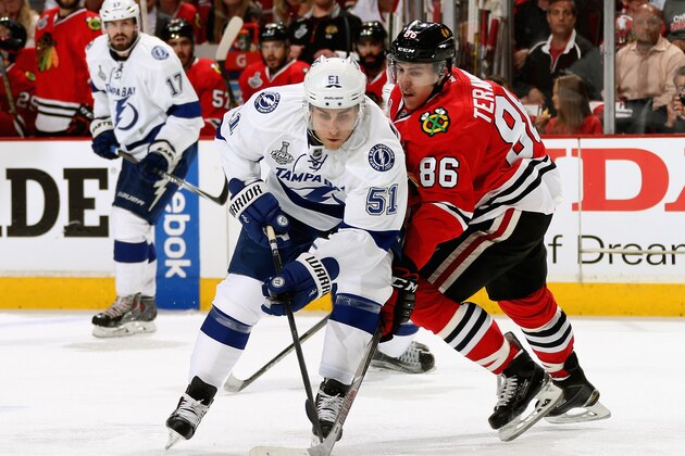 CHICAGO, IL - JUNE 08:  Valtteri Filppula #51 of the Tampa Bay Lightning and Teuvo Teravainen #86 of the Chicago Blackhawks battle for the puck during the third period of Game Three of the 2015 NHL Stanley Cup Final at United Center on June 8, 2015 in Chicago, Illinois.  (Photo by Dave Sandford/NHLI via Getty Images)