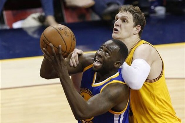 Golden State Warriors forward Draymond Green, left, is fouled by Cleveland Cavaliers center Timofey Mozgov during the first half of Game 3 of basketball's NBA Finals in Cleveland, Tuesday, June 9, 2015. (AP Photo/Paul Sancya) Golden State Warriors forward Draymond Green, left, is fouled by Cleveland Cavaliers center Timofey Mozgov during the first half of Game 3 of basketball's NBA Finals in Cleveland, Tuesday, June 9, 2015. (AP Photo/Paul Sancya)