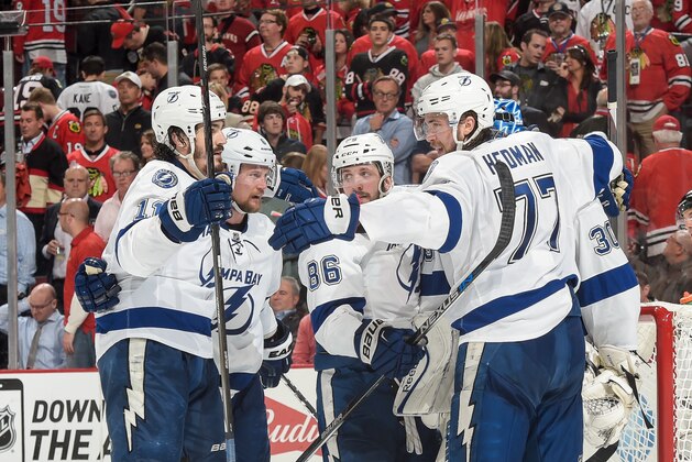 CHICAGO, IL - JUNE 08:  (L-R) Brian Boyle #11, Anton Stralman #6, Nikita Kucherov #86 and Victor Hedman #77 of the Tampa Bay Lightning celebrate after defeating the Chicago Blackhawks 3-2 during Game Three of the 2015 NHL Stanley Cup Final at the United Center on June 8, 2015 in Chicago, Illinois.  (Photo by Bill Smith/NHLI via Getty Images)