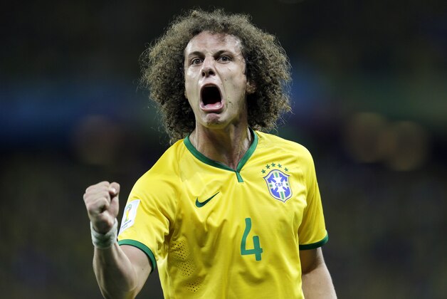 Brazil's David Luiz celebrates after scoring his side's second goal on a free kick during the World Cup quarterfinal soccer match between Brazil and Colombia at the Arena Castelao in Fortaleza, Brazil, Friday, July 4, 2014. (AP Photo/Natacha Pisarenko)
