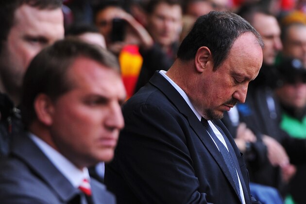 LIVERPOOL, ENGLAND - APRIL 21:  Rafael Benitez, interim manager of Chelsea looks at his watch with Brendan Rodgers, manager of Liverpool prior to the Barclays Premier League match between Liverpool and Chelsea at Anfield on April 21, 2013 in Liverpool, England.  (Photo by Michael Regan/Getty Images)