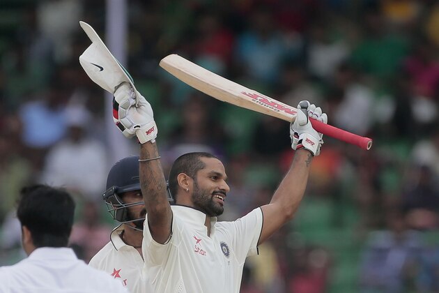 India’s Shikhar Dhawan, acknowledges the crowd after scoring a hundred runs during the first day of their test cricket match against Bangladesh in Fatullah, Bangladesh, Wednesday, June 10, 2015. (AP Photo/A.M. Ahad)