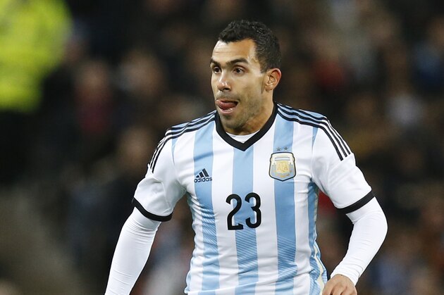 Carlos Tevez of Argentina is seen during his team's  International Friendly soccer match against Portugal at Old Trafford Stadium, Manchester, England, Tuesday Nov. 18, 2014. (AP Photo/Jon Super)