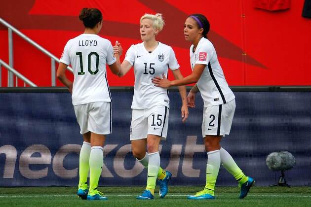 WINNIPEG, MB - JUNE 08:  Megan Rapinoe #15 celebrates with Carli Lloyd #10 and Sydney Leroux #2 of United States after Rapinoe scores her second goal against Australia in the second half during the FIFA Women's World Cup 2015 Group D match at Winnipeg Stadium on June 8, 2015 in Winnipeg, Canada.  (Photo by Kevin C. Cox/Getty Images)