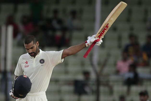 India’s Shikhar Dhawan, acknowledges the crowd after scoring a hundred and fifty runs  during the first day of their test cricket match against Bangladesh in Fatullah, Bangladesh, Wednesday, June 10, 2015. (AP Photo/A.M. Ahad)
