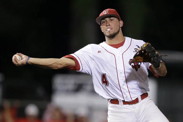Louisiana Lafayette infielder Blake Trahan (4) tuns a double play in the second inning of an NCAA college baseball tournament super regional game against Mississippi in Lafayette, La.,Sunday, June 8, 2014. Mississippi won 5-2. (AP Photo/Gerald Herbert)