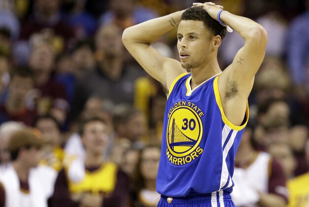 Golden State Warriors guard Stephen Curry (30) watches as the referees check a replay during the second half of Game 3 of basketball's NBA Finals against the Cleveland Cavaliers in Cleveland, Tuesday, June 9, 2015. The Cavaliers defeated the Warriors 96-91. AP Photo/Tony Dejak)