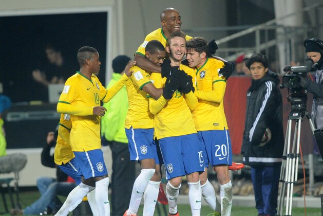 Brazil's Leo Pereira, second right, is congratulated by his teammates after scoring a goal during their U20 soccer World Cup match against North Korea in Christchurch, New Zealand, Sunday, June 7, 2015. (AP Photo/Ross Setford)