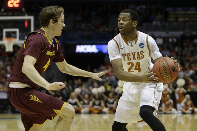 MILWAUKEE, WI - MARCH 20: Martez Walker #24 of the Texas Longhorns looks to pass the basketball in the first half of play against the Arizona State Sun Devils during the game at BMO Harris Bradley Center on March 20, 2014 in Madison, Wisconsin. (Photo by Mike McGinnis/Getty Images)