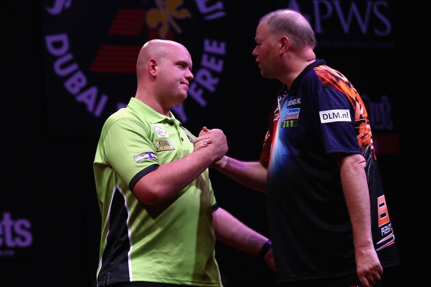 DUBAI, UNITED ARAB EMIRATES - MAY 28: Michael Van Gerwen of the Netherlands is congratulated by  Raymond Van Barneveld of the Netherlands after  the 2015 Dubai Duty Free Darts Masters Quarter-Final match at Dubai Duty Free Tennis Stadium on May 28, 2015 in Dubai, United Arab Emirates.  (Photo by Francois Nel/Getty Images)