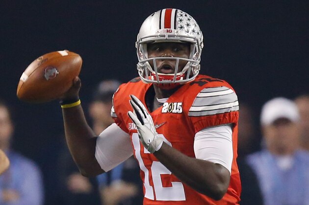 Jan 12, 2015; Arlington, TX, USA; Ohio State Buckeyes quarterback Cardale Jones (12) in game action against the Oregon Ducks  in the 2015 CFP National Championship Game at AT&T Stadium. Ohio State won 42-20. Mandatory Credit: Tim Heitman-USA TODAY Sports