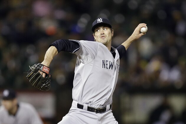 New York Yankees' Andrew Miller works against the Oakland Athletics during the ninth inning of a baseball game Saturday, May 30, 2015, in Oakland, Calif. (AP Photo/Ben Margot)