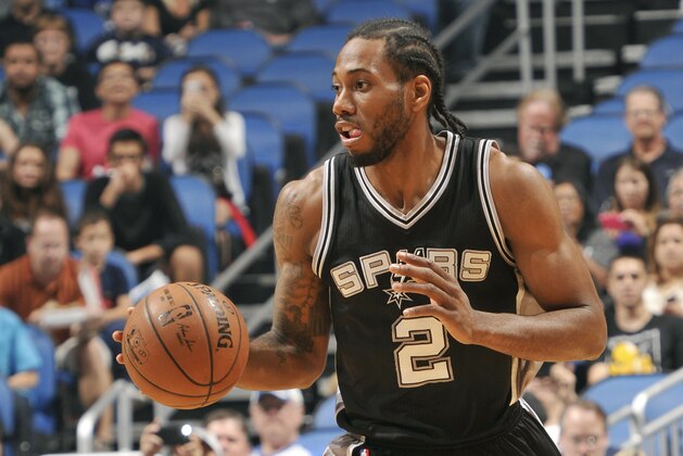 ORLANDO, FL - APRIL 1: Kawhi Leonard #2 of the San Antonio Spurs drives against the Orlando Magic on April 1, 2015 at Amway Center in Orlando, Florida. NOTE TO USER: User expressly acknowledges and agrees that, by downloading and or using this photograph, User is consenting to the terms and conditions of the Getty Images License Agreement. Mandatory Copyright Notice: Copyright 2015 NBAE (Photo by Fernando Medina/NBAE via Getty Images