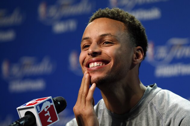 Golden State Warriors guard Stephen Curry answers a question during press conference for basketball's NBA Finals in Cleveland, Wednesday, June 10, 2015. The Cleveland Cavaliers lead the Warriors 2-1 in the best-of-seven games series.  Game 4 is scheduled for Thursday. (AP Photo/Paul Sancya)