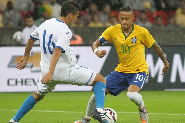 Brazil's Neymar, right, fights for the ball with Honduras' Johnny Leveron during a friendly soccer match in Porto Alegre, Brazil, Wednesday, June 10, 2015. Brazil is preparing for the Copa America which begins Thursday in Chile. (AP Photo/Nabor Goulart) Brazil's Neymar, right, fights for the ball with Honduras' Johnny Leveron during a friendly soccer match in Porto Alegre, Brazil, Wednesday, June 10, 2015. Brazil is preparing for the Copa America which begins Thursday in Chile. (AP Photo/Nabor Goulart)