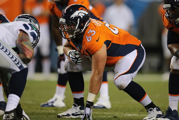 DENVER, CO - AUGUST 07:  Guard Ben Garland #63 of the Denver Broncos guards the line of scrimmage against the Seattle Seahawks during preseason action at Sports Authority Field at Mile High on August 7, 2014 in Denver, Colorado. The Broncos defeated the Seahawks 21-16.  (Photo by Doug Pensinger/Getty Images)
