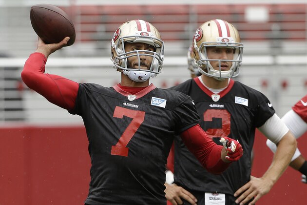 San Francisco 49ers quarterback Colin Kaepernick (7) passes as Blaine Gabbert (2) watches during an NFL football mini-camp in Santa Clara, Calif., Wednesday, June 10, 2015. (AP Photo/Jeff Chiu)
