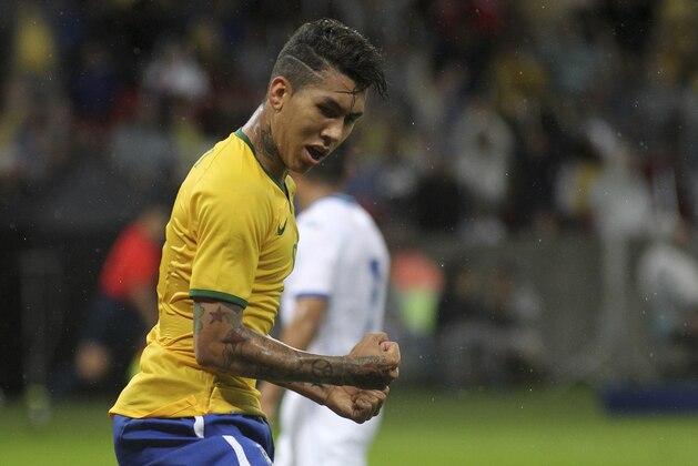 Brazil's Roberto Firmino celebrates after scoring a goal during a friendly soccer match against Honduras in Porto Alegre, Brazil, Wednesday, June 10, 2015. Brazil is preparing for the Copa America which begins Thursday in Chile. (AP Photo/Nabor Goulart)