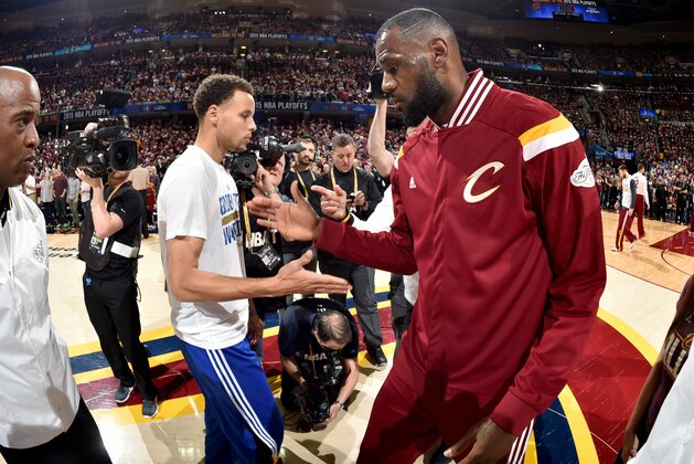 CLEVELAND, OH - JUNE 9: Stephen Curry #30 of the Golden State Warriors and LeBron James #23 of the Cleveland Cavaliers shake hands before Game Three of the 2015 NBA Finals at The Quicken Loans Arena on June 9, 2015 in Cleveland, Ohio. NOTE TO USER: User expressly acknowledges and agrees that, by downloading and/or using this Photograph, user is consenting to the terms and conditions of the Getty Images License Agreement. Mandatory Copyright Notice: Copyright 2015 NBAE (Photo by Andrew D. Bernstein/NBAE via Getty Images)