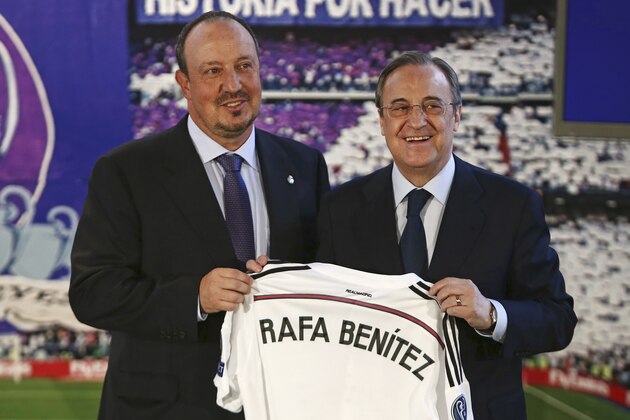 New Real Madrid coach Rafael Benitez, left, and Real Madrid's President Florentino Perez, right,  pose for a picture during his official presentation at the Santiago Bernabeu stadium in Madrid, Spain, Wednesday, June 3, 2015, after signing for Real Madrid. (AP Photo/Andres Kudacki)