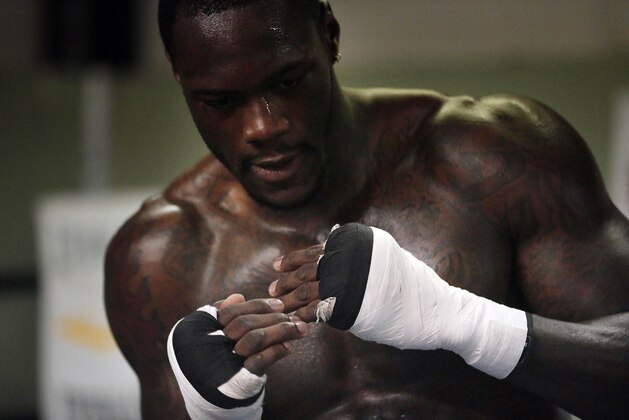 FILE - In this May 28, 2015, file photo, WBC heavyweight boxing champion Deontay Wilder works out at Skyy Boxing Gym in Northport, Ala.  Wilder's fight at Bartow Area in Birmingham this Saturday night against Eric Molina, is being dubbed a homecoming for the champion. In some ways it is. He will be fighting some 60 miles from where he was born and raised. (AP Photo/Brynn Anderson, File)